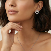 Pearl Orbit freshwater pearl stud earring with crystal accents styled on model | Olaty