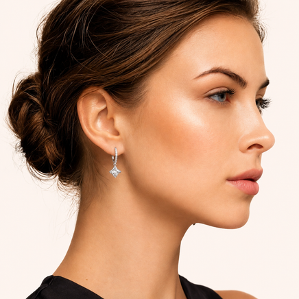 Close-up profile of model wearing GRA Certified Moissanite Diamond Dangle Huggies | Olaty