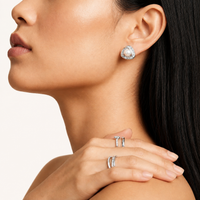 Luminous Pearl Triangle statement stud earring with freshwater pearl and baguette stones styled on model | Olaty