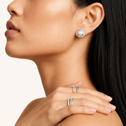 Luminous Pearl Triangle statement stud earring with freshwater pearl and baguette stones styled on model | Olaty