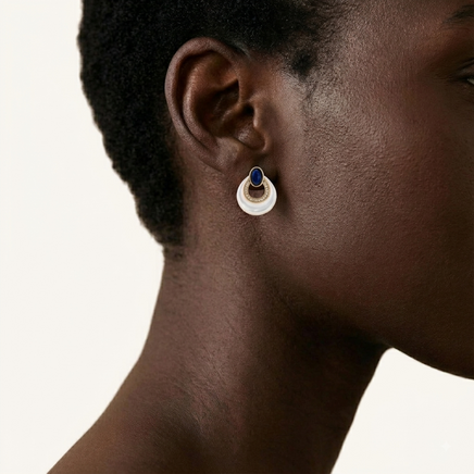 Close-up profile of model wearing Lapis Lazuli and Mother of Pearl stud earring with gold-tone detailing | Olaty