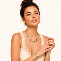 Model wearing Garden Bloom multicolor floral necklace pearl drop earrings and bracelet | Olaty