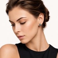 Model wearing Green Moissanite Diamond Emerald Spark Halo Stud Earring in polished sterling silver | Olaty