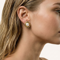 Close-up profile of model wearing Mother of Pearl and green Zirconia round stud earring | Olaty