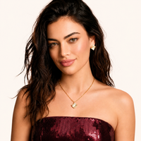 Model wearing wave pavé necklace and matching sculptural stud earrings | Olaty