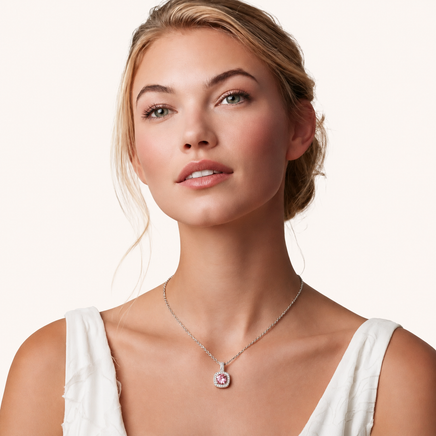 Model wearing GRA certified pink moissanite pendant necklace in sterling silver | Olaty