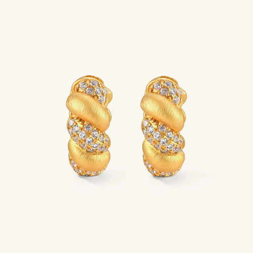 Product video showcasing Braided Pavé Huggie Hoop Earrings with sparkling pavé details, sculptural braided texture and an elegant huggie hoop design | Olaty