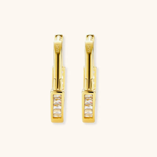 Product video showcasing Golden Hour Geometric Huggie Hoop Earrings with sculptural geometric details and a polished gold-tone huggie hoop design | Olaty