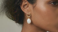 Product video showcasing Pearl Glow Sculptural Drop Earrings with lustrous pearl drops and sculptural gold-tone details | Olaty
