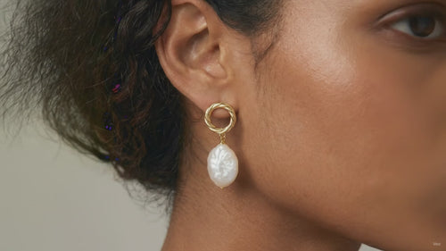 Product video showcasing Pearl Glow Sculptural Drop Earrings with lustrous pearl drops and sculptural gold-tone details | Olaty