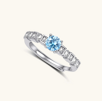 Product video showcasing GRA Certified Light Blue Moissanite Diamond Skyline Ring with a brilliant light blue moissanite center stone and sparkling skyline-inspired details | Olaty