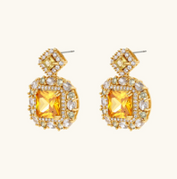 Product video showcasing Golden Square Zirconia Statement Necklace & Earrings Set with sparkling square zirconia details, bold geometric design and coordinated statement necklace and earrings | Olaty