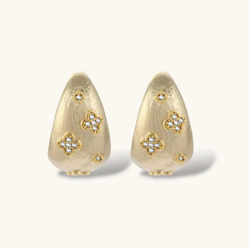 Product video showcasing Clover Statement Hoop Earrings with clover-inspired details and a bold sculptural hoop design | Olaty