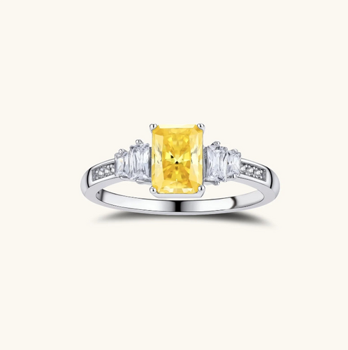 Product video showcasing GRA Certified Yellow Moissanite Diamond Radiant Three Stone Ring with brilliant yellow moissanite stones and an elegant three-stone design | Olaty