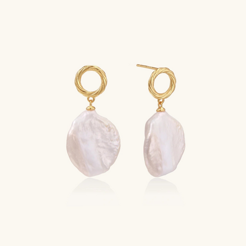 Product video showcasing Pearl Glow Sculptural Drop Earrings with lustrous pearl drops and sculptural gold-tone details | Olaty