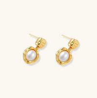 Product video showcasing Golden Bloom Freshwater Pearl Drop Earrings with lustrous freshwater pearl drops and elegant gold-tone floral-inspired details | Olaty