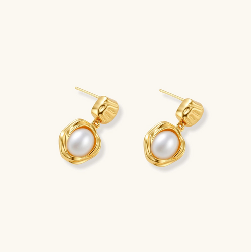 Product video showcasing Golden Bloom Freshwater Pearl Drop Earrings with lustrous freshwater pearl drops and elegant gold-tone floral-inspired details | Olaty