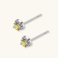Product video showcasing GRA Certified Yellow Moissanite Diamond Sunburst Halo Stud Earrings with brilliant yellow moissanite center stones and sparkling sunburst halo details | Olaty