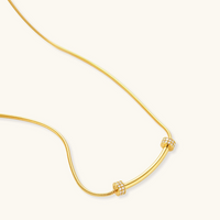 Product video showcasing Curved Spark Bar Necklace with a sleek curved bar pendant and sparkling accent details | Olaty