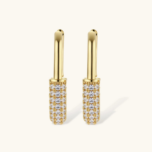 Product video showcasing Golden Glow Zirconia Huggie Hoop Earrings with sparkling zirconia details and a polished gold-tone huggie hoop design | Olaty