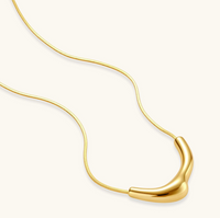 Product video showcasing Curve Statement Pendant Necklace with a bold sculptural curved pendant and polished statement design | Olaty
