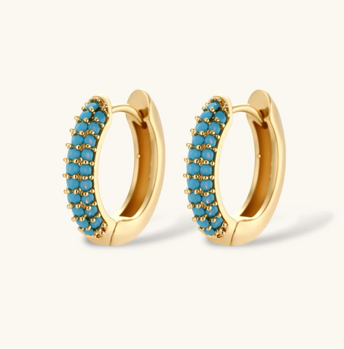 Product video showcasing Turquoise Curve Necklace & Huggie Hoop Earrings Set with vibrant turquoise details, sculptural curved design and coordinated necklace and huggie hoop earrings | Olaty