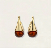 Product video showcasing Amber Sculptural Drop Earrings with warm amber-toned drops and bold sculptural details | Olaty