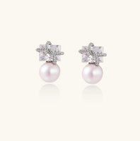 Product video showcasing Stardust Pearl Drop Earrings with lustrous pearl drops and celestial-inspired stardust details | Olaty