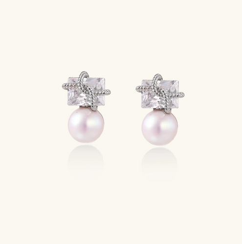 Product video showcasing Stardust Pearl Drop Earrings with lustrous pearl drops and celestial-inspired stardust details | Olaty