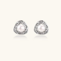 Product video showcasing Luminous Pearl Triangle Stud Earrings with lustrous pearl details and a modern geometric triangle design | Olaty