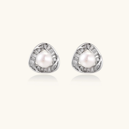 Product video showcasing Luminous Pearl Triangle Stud Earrings with lustrous pearl details and a modern geometric triangle design | Olaty