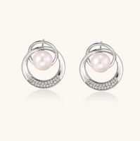 Product video showcasing Pearl Orbit Stud Earrings with lustrous pearl accents and an elegant orbit-inspired stud design | Olaty