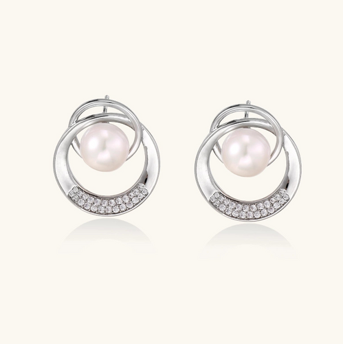 Product video showcasing Pearl Orbit Stud Earrings with lustrous pearl accents and an elegant orbit-inspired stud design | Olaty