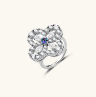Product video showcasing GRA Certified Prismatic Moissanite Diamond Bloom Ring with brilliant prismatic moissanite stones and sparkling floral bloom-inspired details | Olaty