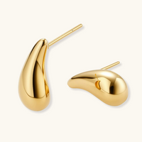 Product video showcasing Golden Teardrop Studs with elegant teardrop-shaped forms and a polished gold-tone sculptural design | Olaty