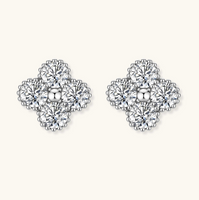 Product video showcasing GRA Certified Moissanite Diamond Quatrefoil Stud Earrings with brilliant moissanite stones and sparkling quatrefoil-inspired details | Olaty