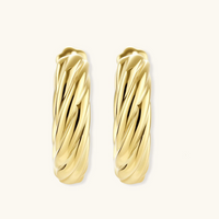 Product video showcasing Twisted Gold Huggie Hoops with sculptural twisted details and a polished gold-tone huggie hoop design | Olaty