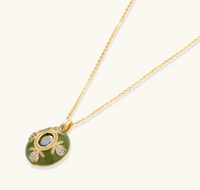 Product video showcasing Emerald Empress Vintage Pendant Necklace with an emerald green centerpiece, ornate vintage-inspired details and a gold-tone chain | Olaty
