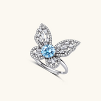 Product video showcasing GRA Certified Blue Moissanite Diamond Butterfly Statement Ring with brilliant blue moissanite stones and sparkling butterfly-inspired details | Olaty