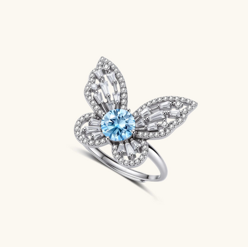 Product video showcasing GRA Certified Blue Moissanite Diamond Butterfly Statement Ring with brilliant blue moissanite stones and sparkling butterfly-inspired details | Olaty