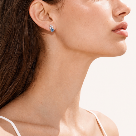 Model wearing GRA Certified Rainbow Moissanite Diamond Lucky Clover Stud Earrings in 925 sterling silver | Olaty